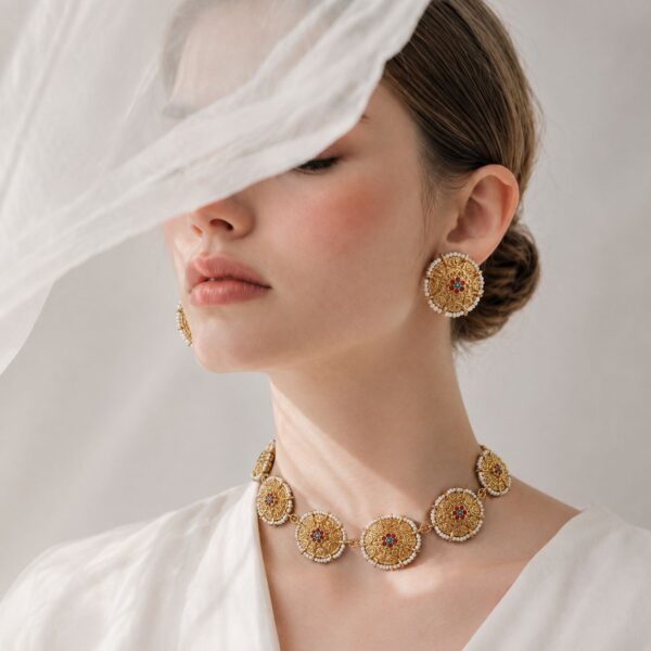 Vintage gold-tone Nigar choker set with central floral design, white bead edging and matching earrings